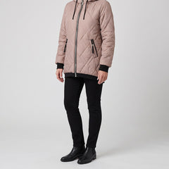 Rolande hooded jacket in dusty rose, worn with black pants and ankle boots