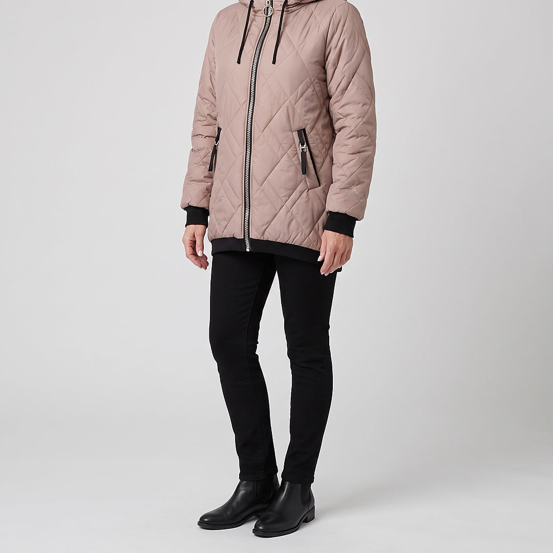 Rolande hooded jacket in dusty rose, worn with black pants and ankle boots