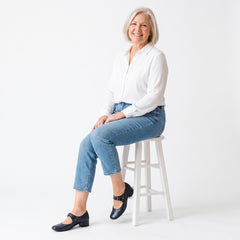 Woman wearing Chloe Mary Jane shoes in navy