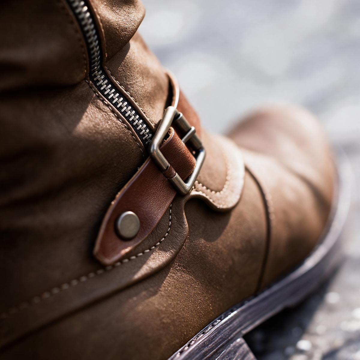 Greta boots, close-up of the buckle strap and side zipper