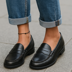 Colette penny loafers in black, worn with jeans