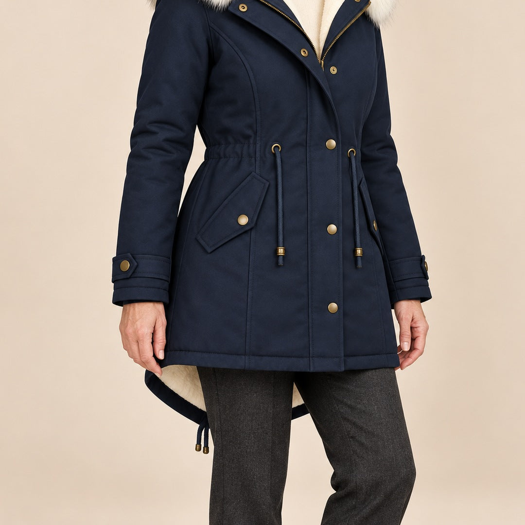 Arvelle winter coat in navy, worn with gray pants