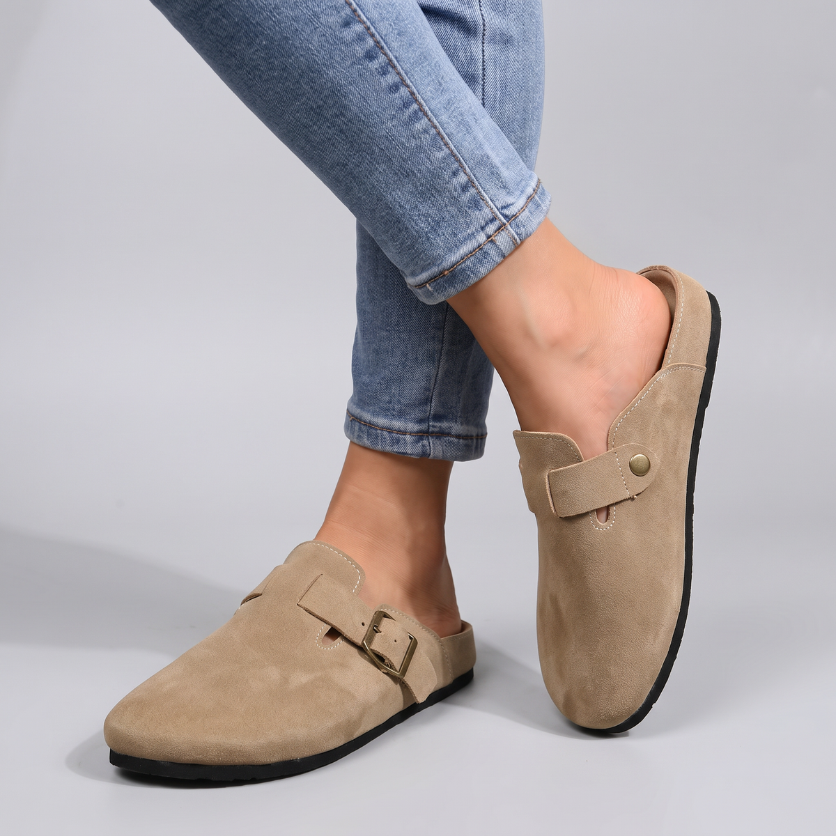 Gwendolyn closed mules with buckle strap worn