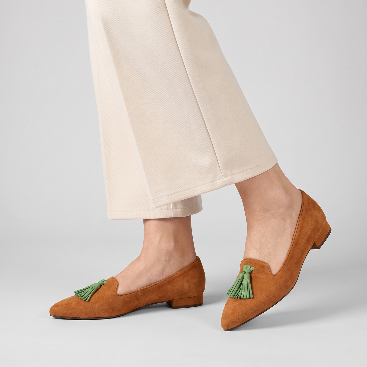 Fleur pointed flats with contrast tassel worn