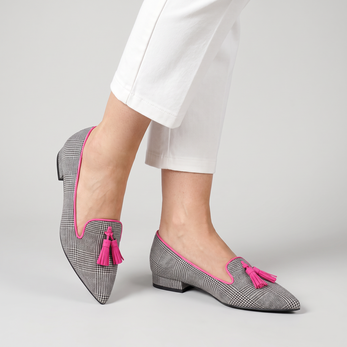 Betty check pointed flats with tassel worn
