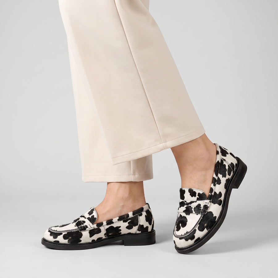 Claria spotted penny loafers with dark sole worn