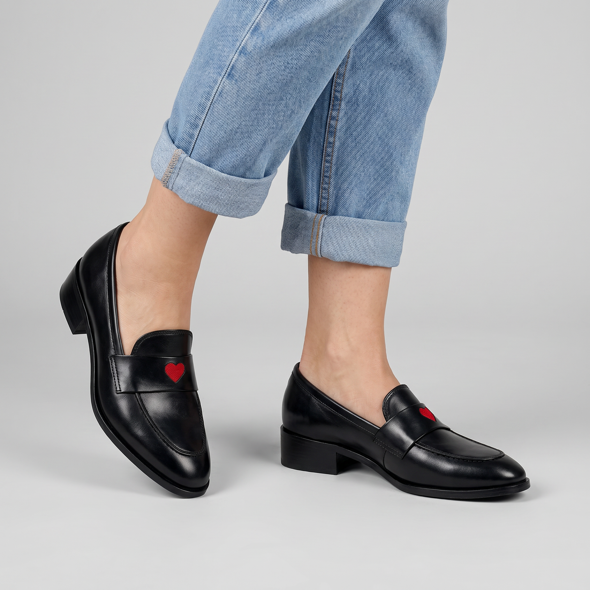 Valentine penny loafers with embroidered heart and block heel worn