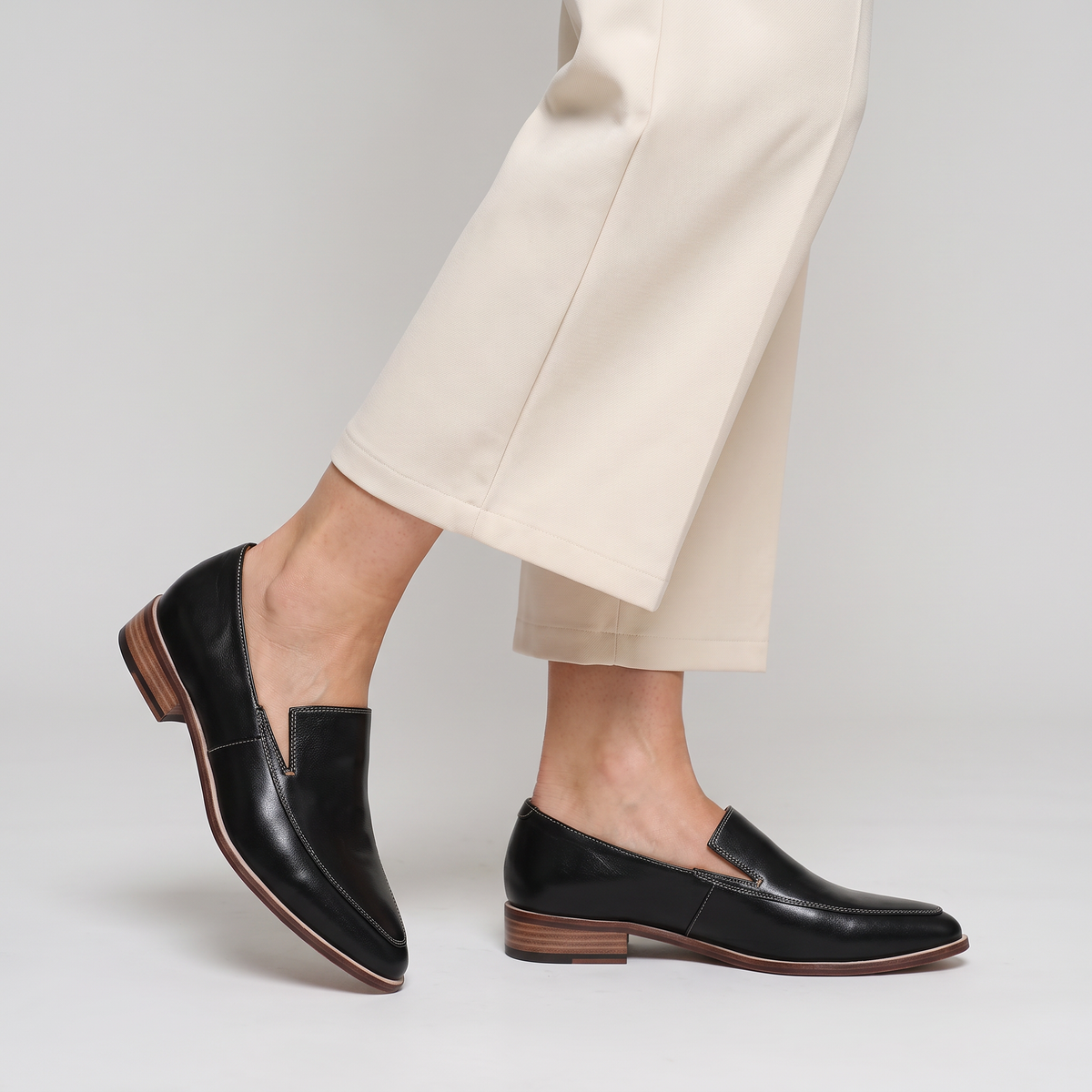 Elina pointed slip-on shoes with visible stitching worn