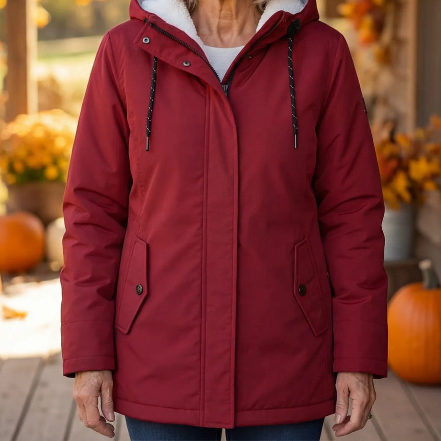 Maeve parka zipped up to the neck in red
